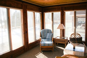 Enclosed front porch where you can enjoy your morning coffee or a good book!
