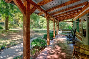 Relax on the porch in the peaceful setting surroundings