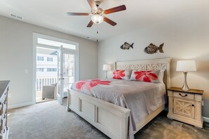 Master bedroom with king bed and balcony. All rooms have smart TVs!
