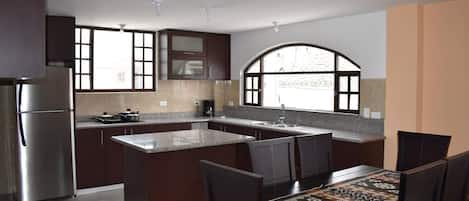 Our spacious and fully-equipped kitchen, with a beautiful view!