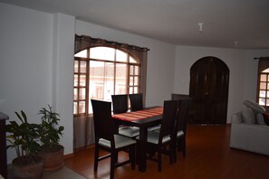 Dining area with door opening to balcony