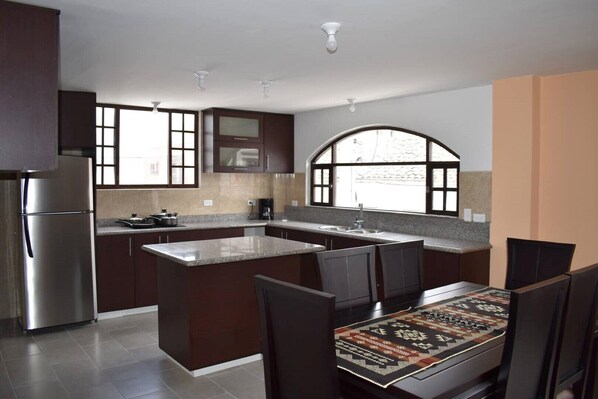 This newly finished, spacious kitchen is fully-equipped, with a beautiful view!