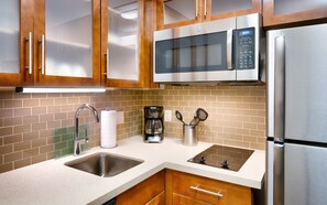 Cook a meal in your kitchen.