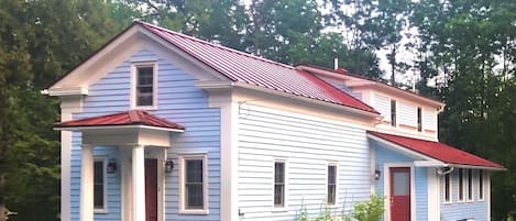 Creekside Greek Revival cottage.