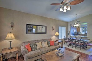 The living area hosts comfortable furnishings for lounging.