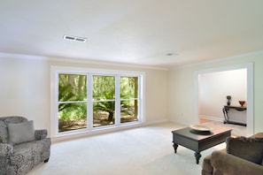 Floor to ceiling windows in the formal living room. 