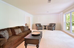 Formal living room immediately to the right of the foyer. 