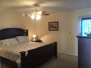 Master Bedroom with door that leads to a back patio.