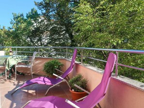 Plant, Tree, Purple, Shade, Outdoor Furniture, Wood, Fence, Terrestrial Plant, Leisure, Urban Design