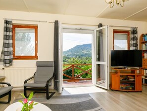 Property, Furniture, Plant, Shelf, Wood, Interior Design, Window, Bookcase, Living Room, Shade