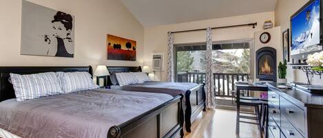 Two Queen Bed Suite: "Cozy setup with patio view, perfect for a relaxing staycation."