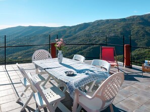 Sky, Table, Furniture, Mountain, Chair, Outdoor Furniture, Shade, Outdoor Table, Leisure, Real Estate