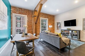 Open concept living, kitchen, dining area with comfortable seating options for you and your guests. 58” Samsung Smart 4K TV for streaming from apps, along with the DIRECTV Entertainment. Dining table with seating for four. All the natural light too!