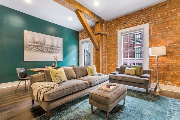 Open concept living, kitchen, dining area with comfortable seating options for you and your guests. 58” Samsung Smart 4K TV for streaming from apps, along with the DIRECTV Entertainment. Dining table with seating for four. All the natural light too!