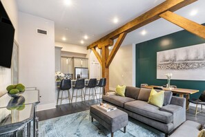 Open concept living, kitchen, dining area with comfortable seating options for you and your guests. 58” Samsung Smart 4K TV for streaming from apps, along with the DIRECTV Entertainment. Dining table with seating for four. All the natural light too!