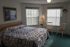 Master Suite with King-Size Bed and Ceiling Fan.