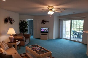 Living Room with Ceiling Fan and Flat-Screen TV.