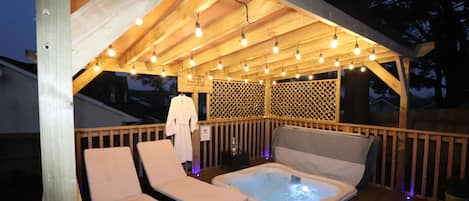 Luxury Jacuzzi hot tub under feature lit canopy