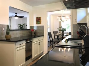 Built in ice-maker, un-cluttered counters, cheery artwork brings a smile