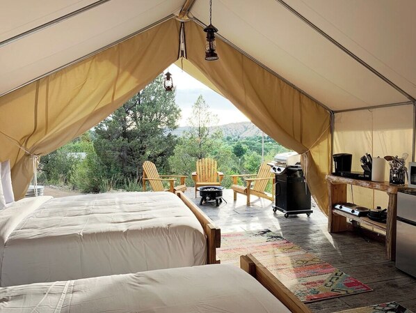Glamping tent #8 has 2 queen beds, private bathroom, heating & air conditioning, bbq grill, outdoor seating seating area with gas firepit, fridge, microwave, keurig coffee maker, cookware, hot plate and kitchen utensils. This is the perfect basecamp!