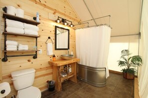 Private bathroom with tub and shower