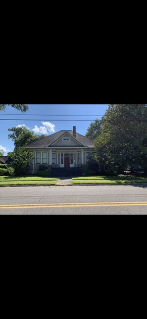 Beautiful view of front of house on large corner lot