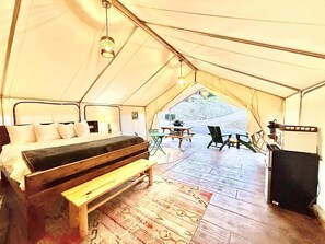 Your luxurious glamping tent will have a king bed, cot, sitting area and all the comforts for your glamping experience.