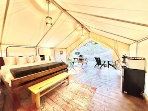 Your luxurious glamping tent will have a king bed, cot, sitting area and all the comforts for your glamping experience.