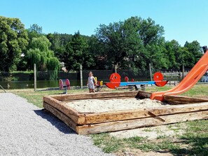 Playground, Public Space, Outdoor Play Equipment, Human Settlement, Tree, Play, Grass, Backyard, City
