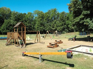 Playground, Outdoor Play Equipment, Public Space, Human Settlement, Play, Recreation, Grass, City, Backyard, Tree