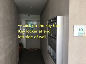 Pick up the key from key locker- left side at end of this passageway