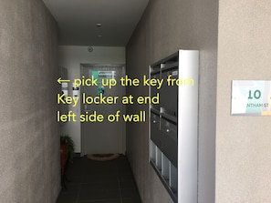 Pick up the key from key locker- left side at end of this passageway