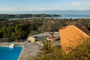 Elegant landscaping and truly impressive views of the bay in the distance