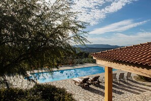 View acrooss pool terrace from balcony