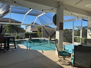 Lanai with 1 tables sitting 4  under cover , Pub table sitting 4 by pool 