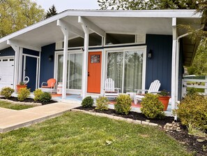 Front of house. Large fenced in backyard with firepit and sitting area