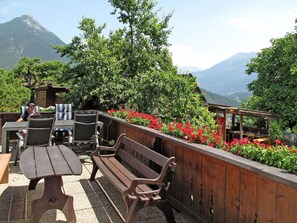 Flower, Sky, Plant, Mountain, Building, Cloud, Flowerpot, Tree, Outdoor Furniture, Urban Design