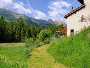 Cloud, Plant, Sky, Mountain, Ecoregion, Building, Natural Landscape, Tree, Highland, Land Lot