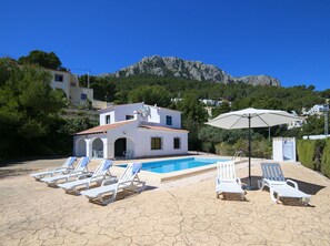 Sky, Building, Azure, Tree, Umbrella, Outdoor Furniture, Shade, Sunlounger, Mountain, Window