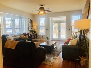 Living room opens to wrap around deck