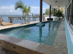 New heated pool 10 feet from Bay + Dock with spa jets + seats to look out to bay