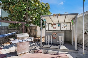 Back yard grill, tiki bar and hammock- so fun!