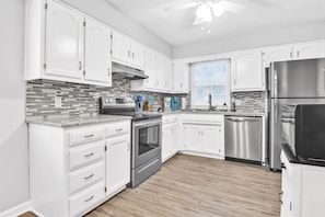 Alternate view of kitchen including the microwave.