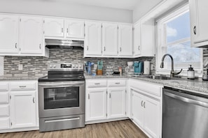 Fully stocked kitchen with stainless appliances