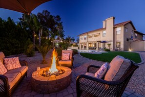 Great outdoor fire pit next to the bocce ball court and sport court!