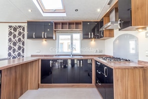 Modern kitchen fully equipped, perfect for self catering holidays!