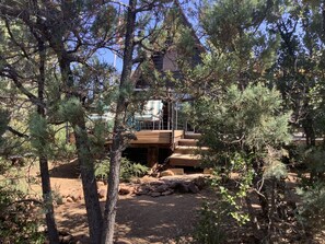 A true A Frame cabin in the woods. 800 square foot front deck. 