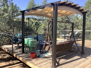 Covered swing and seating area.