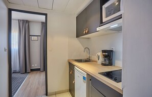 Prepare a small meal in your kitchenette (please note that there is no dishwasher).