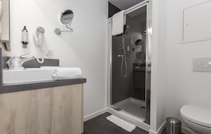 Freshen up in the bathroom after a day of adventure.